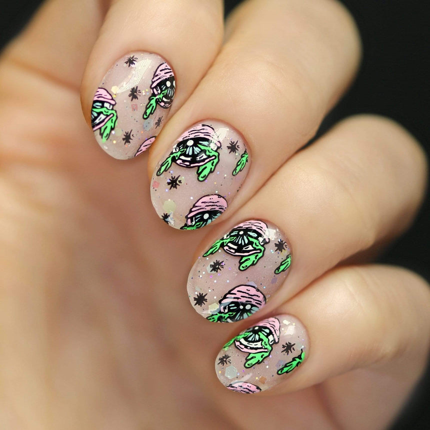 A manicured hand with cyclops cats design by Maniology (m159).
