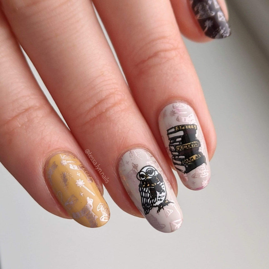 A manicured hand with magic wand, owl and spellbooks design by Maniology (m151).