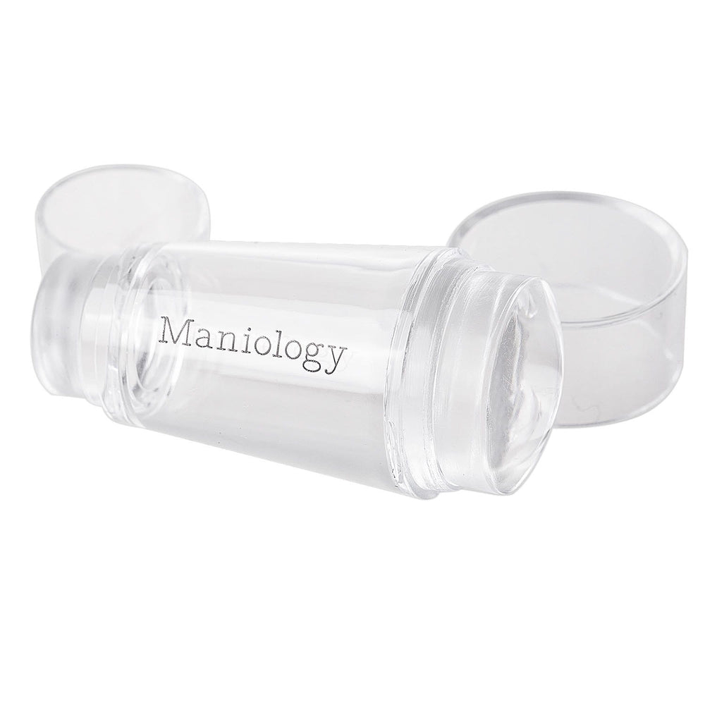 A clear silicone stamping heads that comes in 2 sizes: 0.9 in. and 0.6 in. in diameter and also has clear caps on both ends 