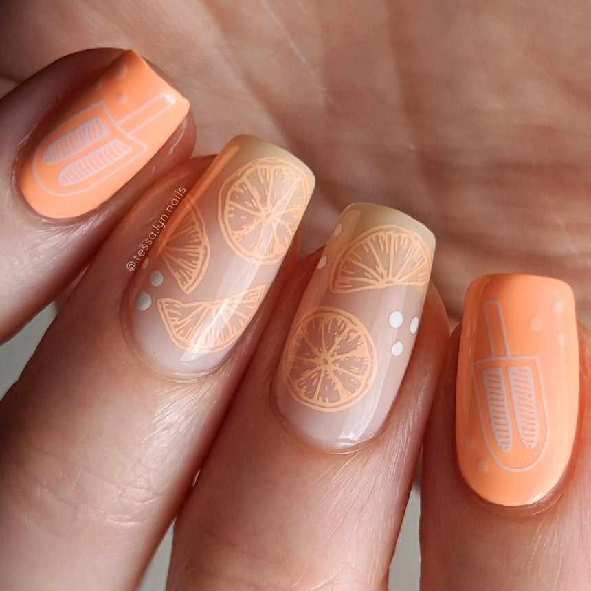 A manicured hand with popsicles and watermelon designs by Maniology Sun & Sand (m104).