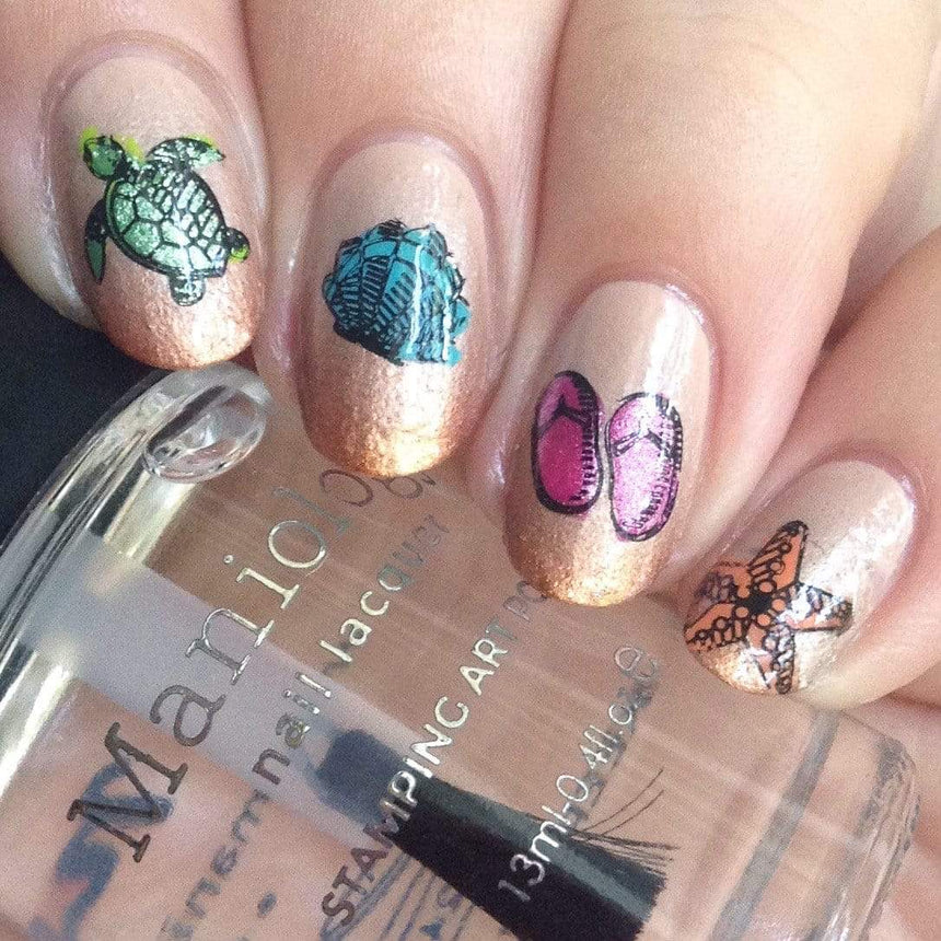 A manicured hand with turtle, starfish, shell and slippers designs holding a polish from Maniology (m104).