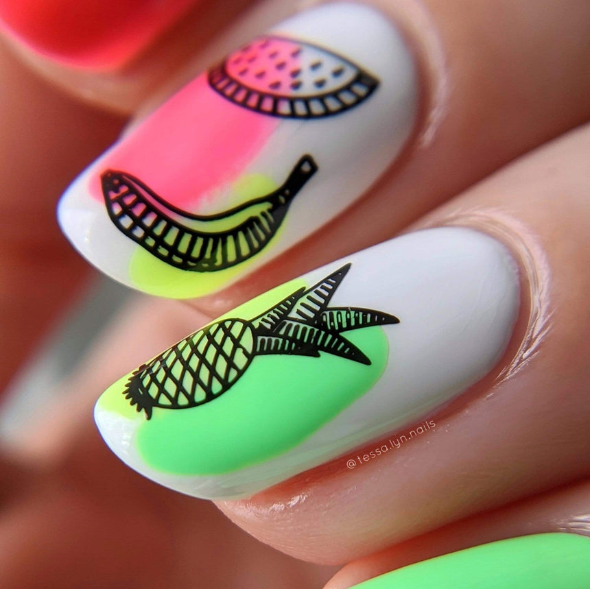 A manicured hand with pineapple, watermelon and banana designs by Maniology Sun & Sand (m104).