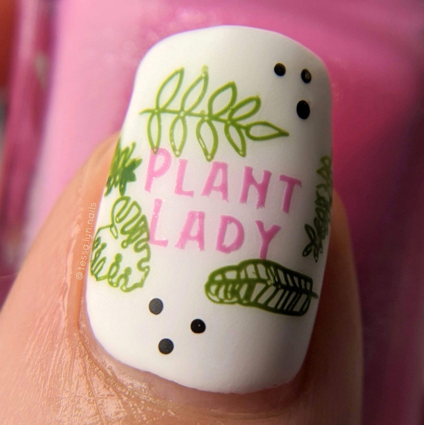 A manicured hand with plants and leaves design by Manilogy (m095).