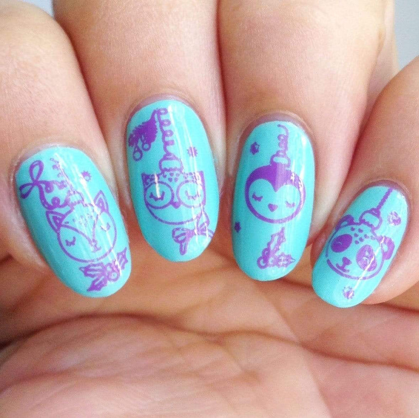 A manicured hand made with icy teal blue Stamping Polish Frosty (B306).