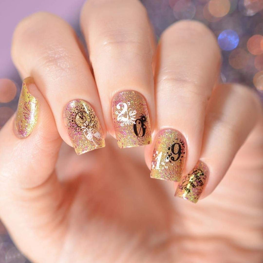 A manicured hand with numbers design for a happy new year.