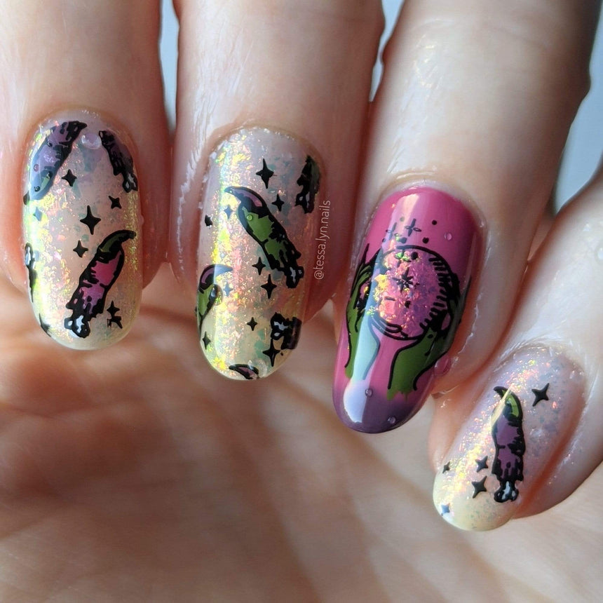 A manicured hand with Transparent Orange Iridescent Flakies by Maniology Illusion (NA027).