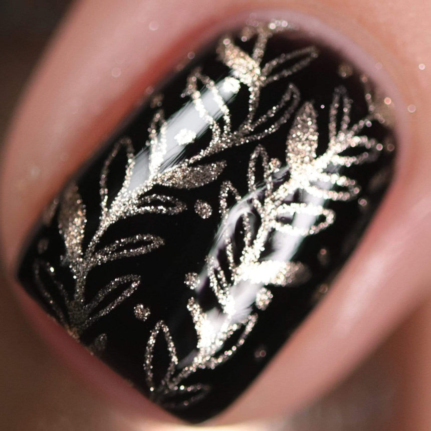 A manicured hand made with Metallic Pale Peach-Beige Orange Stamping Polish by Maniology (B361).