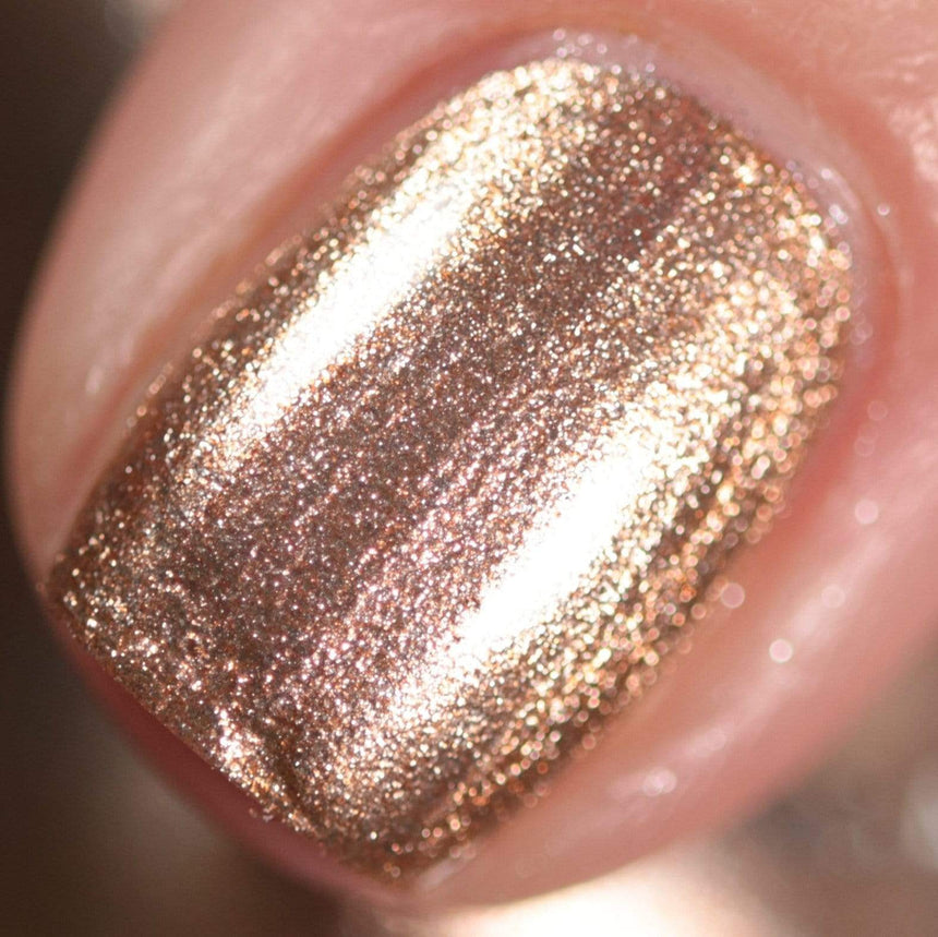 A manicured hand made with Metallic Pale Peach-Beige Orange Stamping Polish by Maniology (B361).