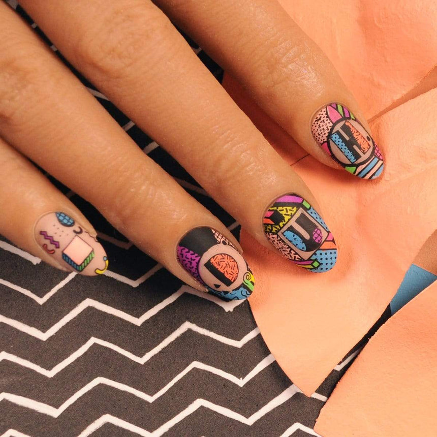 A manicured hand made with creamy pastel pink Salmon Stamping Polish Flashdance (B284) by Maniology.