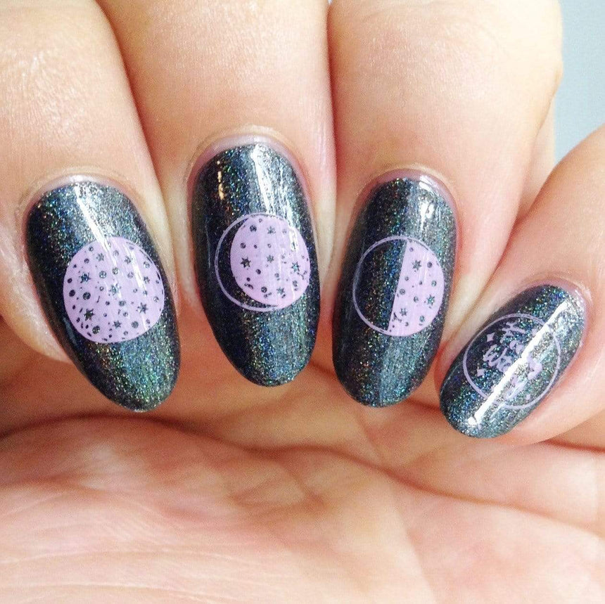 A manicured hand made with Black Magick (B293) Holographic Black Stamping Polish by Maniology.