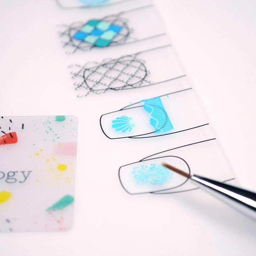 2 Pack Set Maniology Lotus Mat Mini & Go Silicone Nail Art Work Station with a Mini mat for at-home nail art and a travel-sized Go mat for easy manicures anywhere.