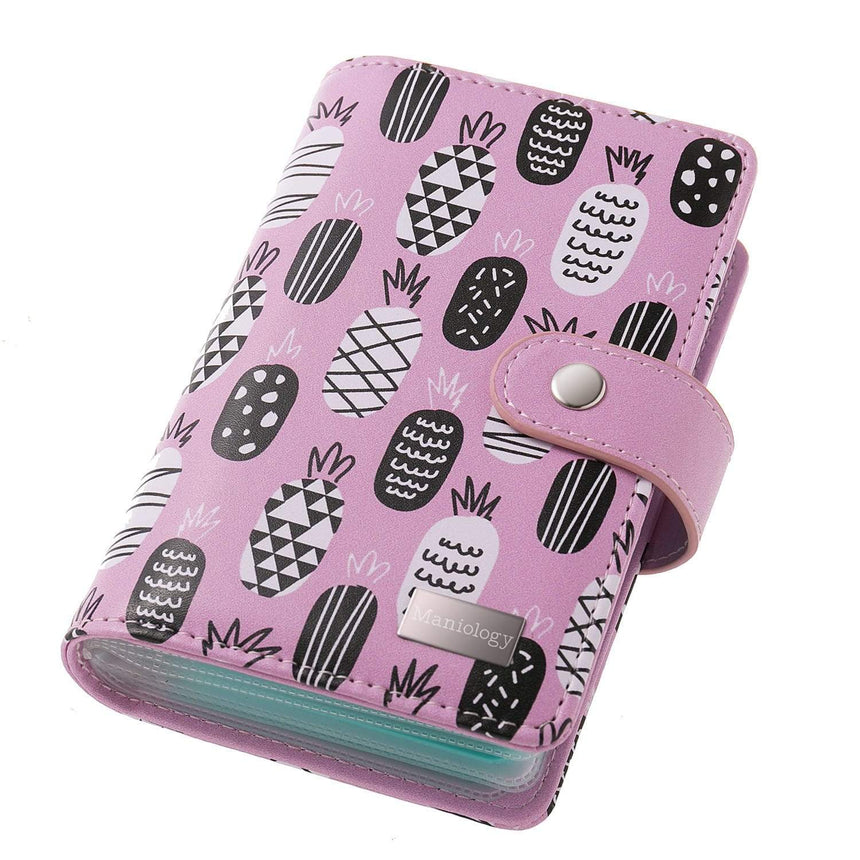 A Mini Pineapple Stamping Plate Organizer that can stores up to 16 XL stamping plates and displays them with sheer white pockets.