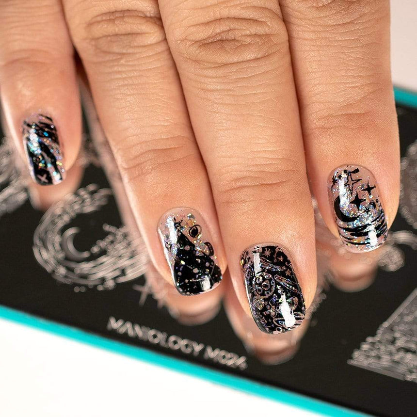 A manicured hand with Negative Space: Starry Night design by Maniology (m024) over a nail stamping plate.