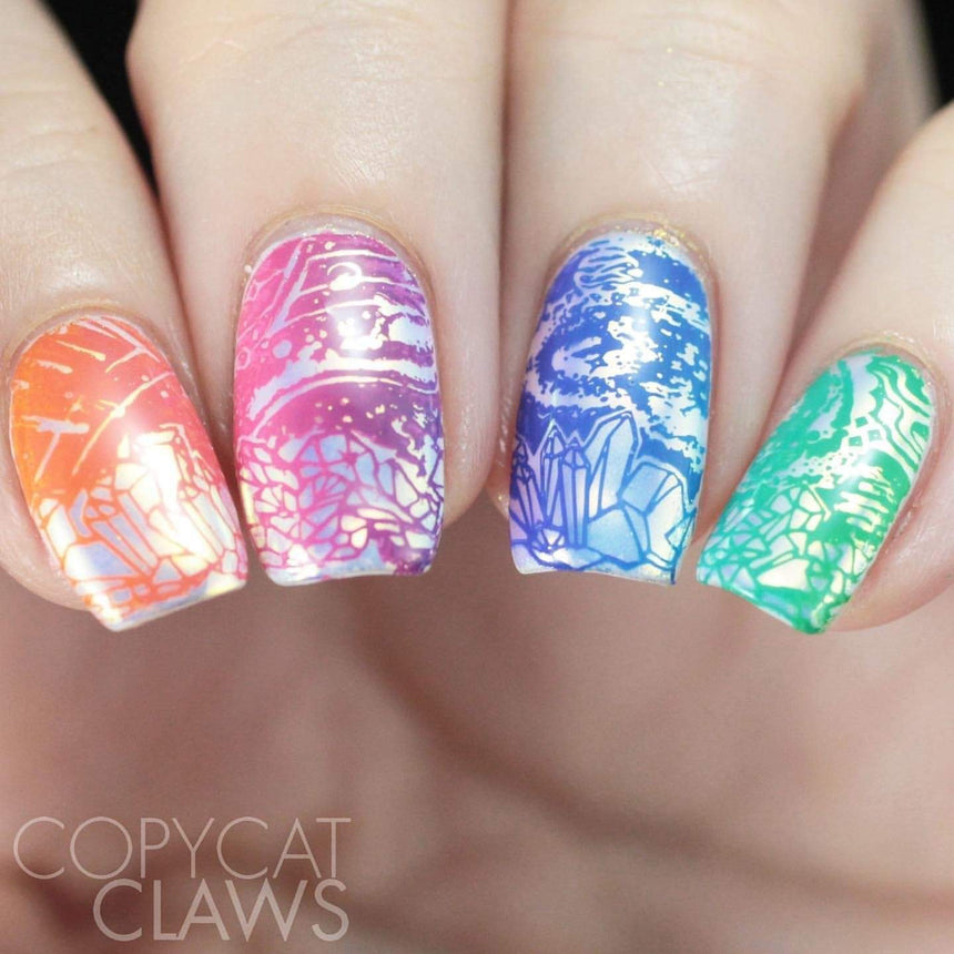 A manicured hand with Negative Space: The Crack in Space designs by Maniology (m025).