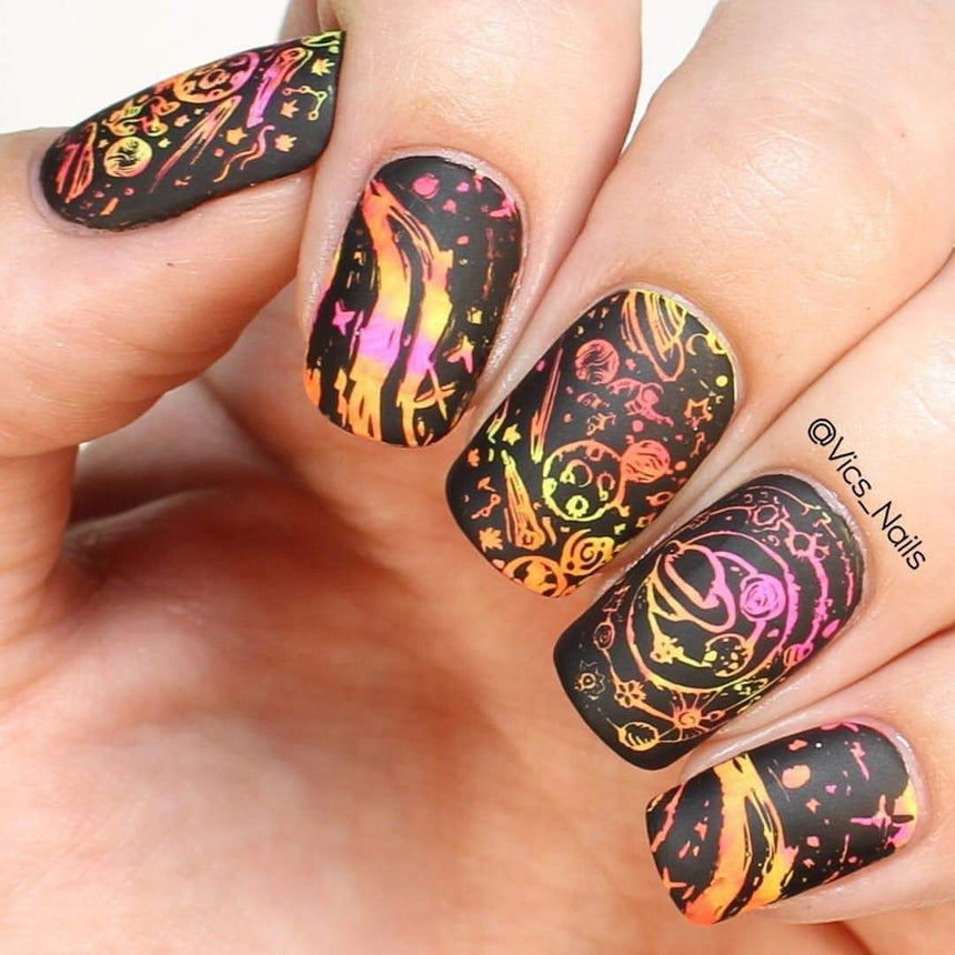 A manicured hand with Negative Space: The Crack in Space designs by Maniology (m025).