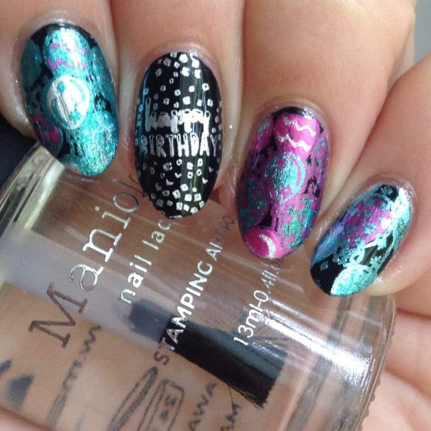 A manicured hand with birthday designs holding a polish by Maniology.