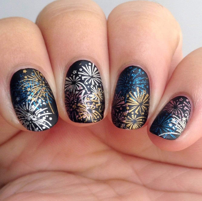 A manicured hand with fireworks design by Maniology Occasions: Stars & Stripes (m054).