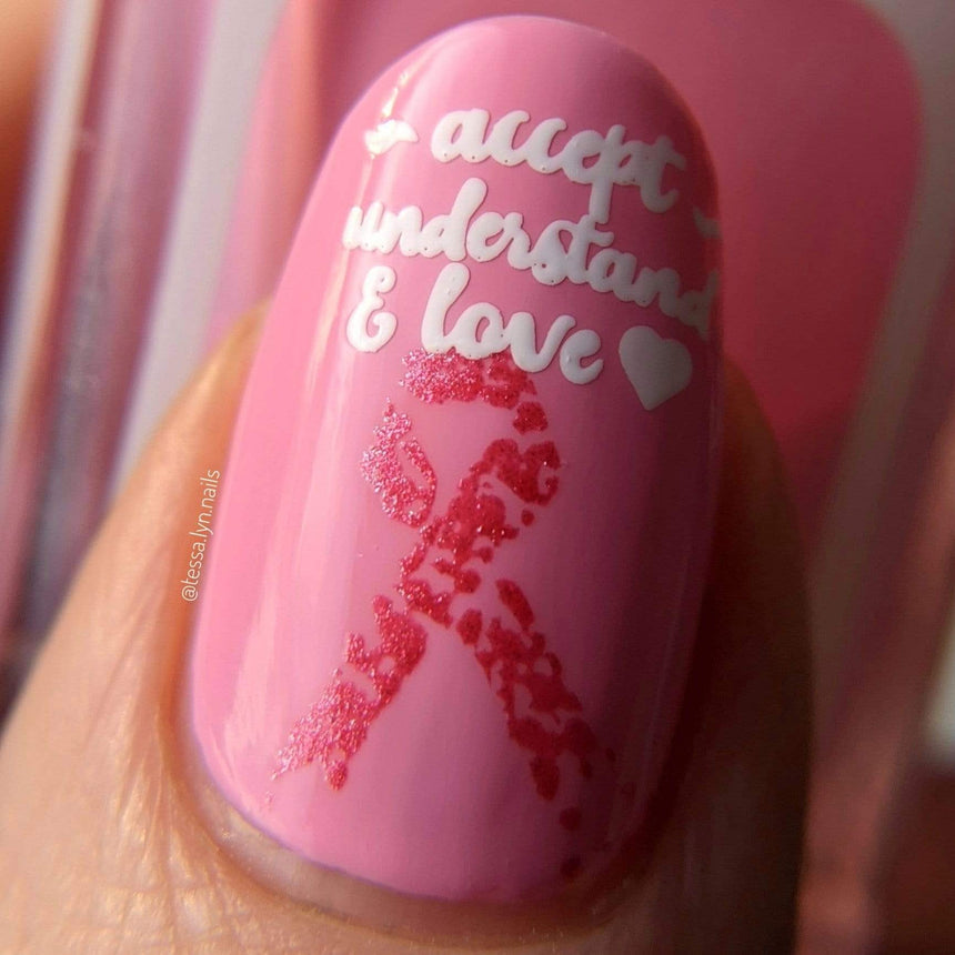 A manicured hand with Ribbons of Hope designs by Maniology (m153)