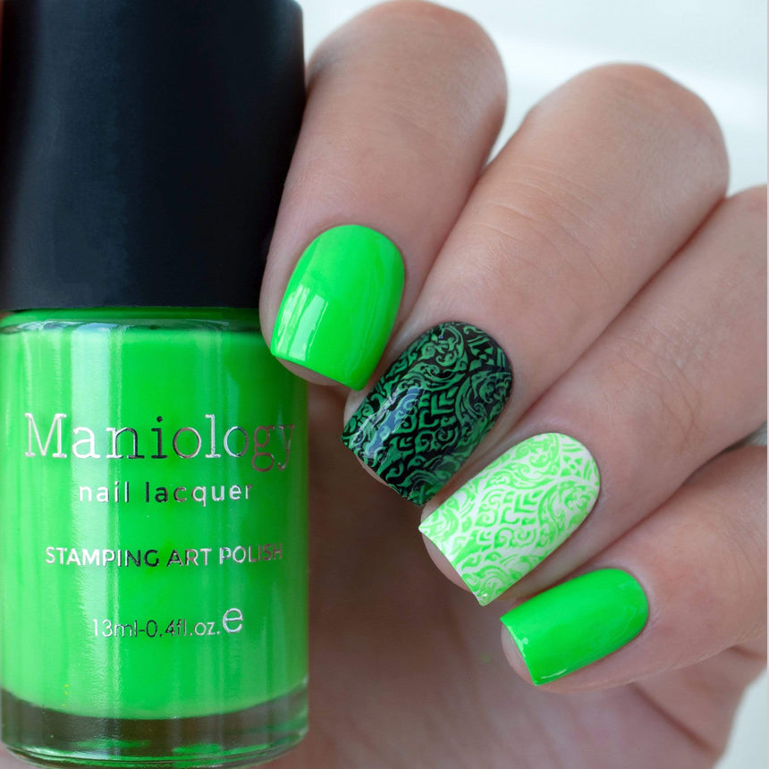 A manicured hand holding Neon Green Stamping Polish from School's Out collection Food Fight (B287).