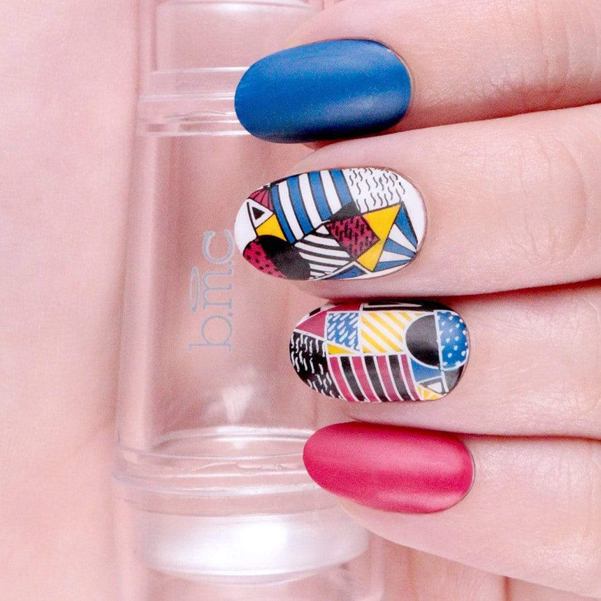 A manicured hand in different designs from Manilogy's Shape Nouveau plates with wild colors holding a stamper.