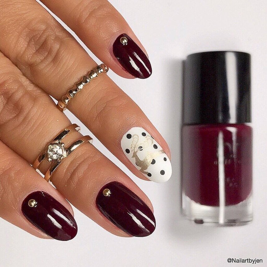 A manicured hand with polish on the side