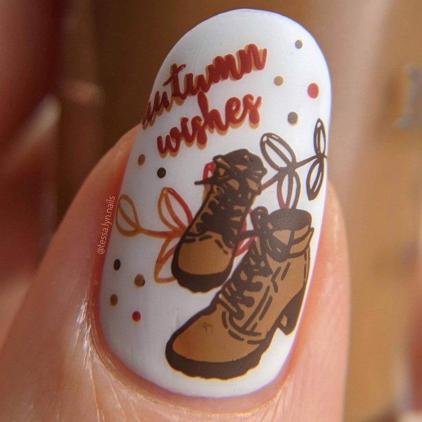 Manicure featuring a pair of boots with "Autumn Wishes'.