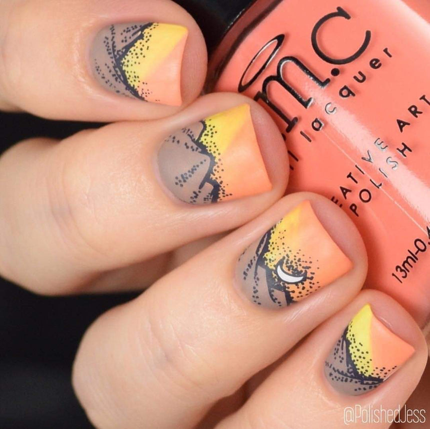 A manicured hand holding a Light Orange Stamping Polish by Maniology.