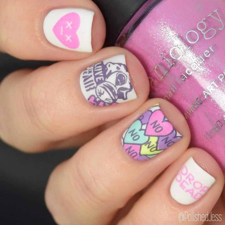 A manicured hand with Valentine's Day Occasions: Opposites Attract designs holding a polish by Maniology (m045).