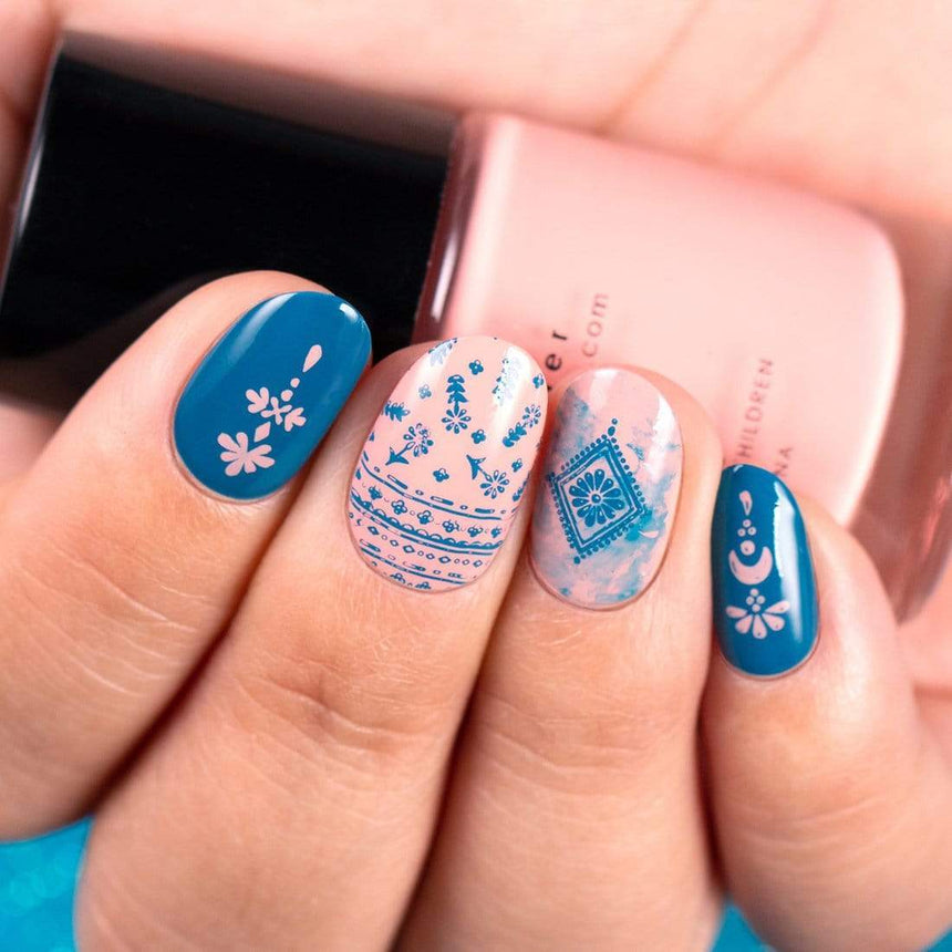 A manicured hand with Wild Heart: Best Fringe Forever design by Maniology (m014) holding a polish.