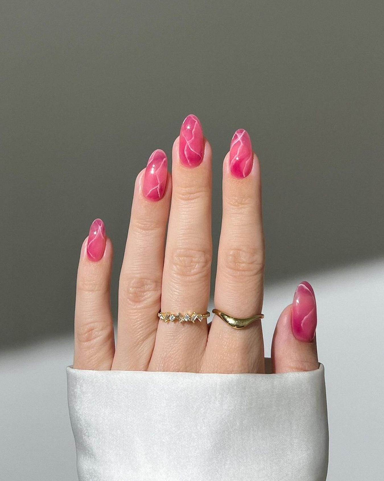 https://maniology.com/cdn/shop/articles/hot-pink-nails.jpg?v=1715994237&width=1600
