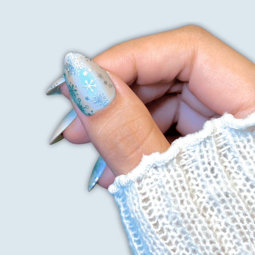 Frosty Puzzle Snowflake Nail Design