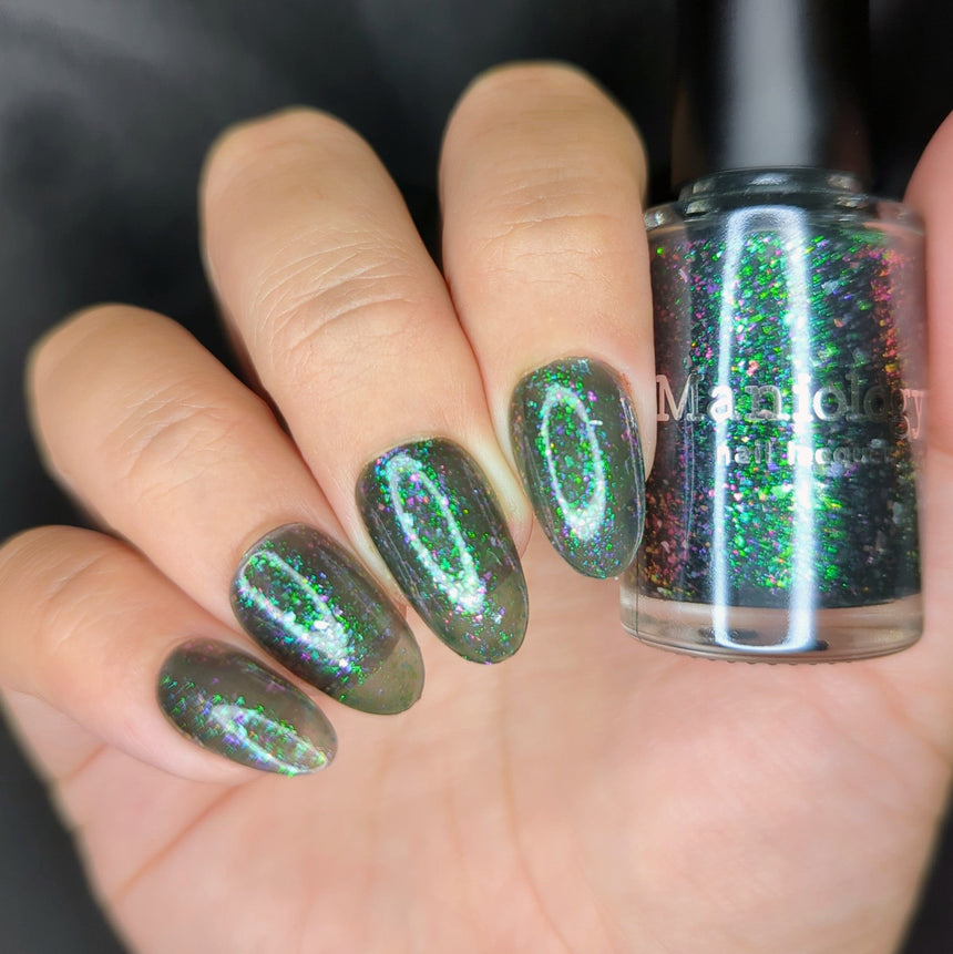 Spectral Shards (P188) - Sheer Tint Black with Green Iridescent Flakies Nail Polish