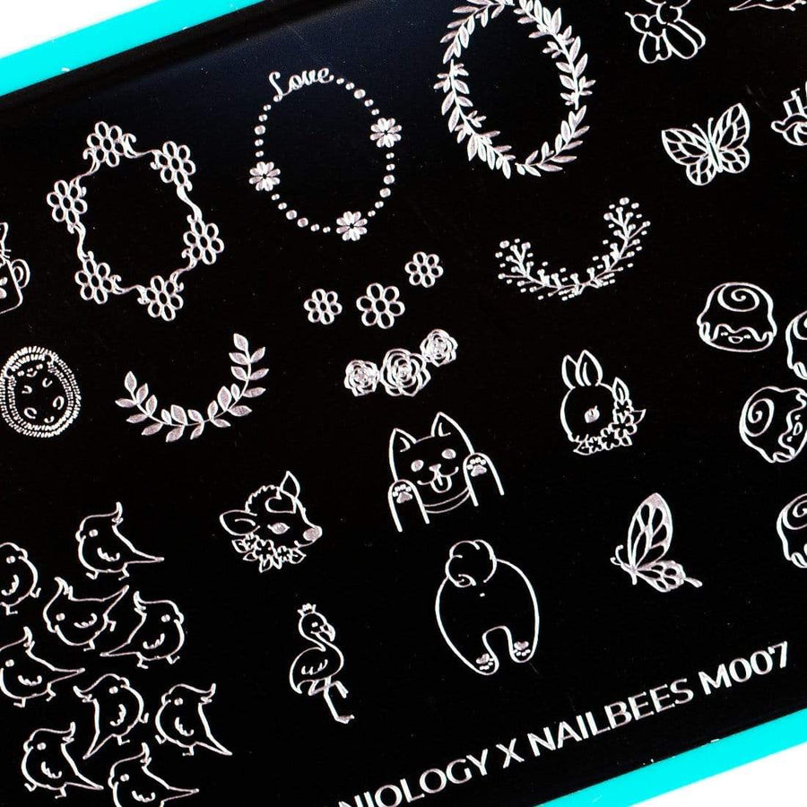 An Artist Collaboration (Nailbees) nail stamping plate featuring tons of kawaii full nail and accent style images with cute animals, floral frames, parakeets, piggies, deer, puppy butts design by Maniology (m007).