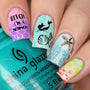 A manicured hand with mermaid, seashell, fishes and starfish design holding a polish.