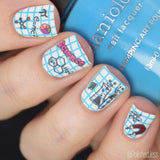 A manicured handwith science equipment and math symbols design holding a polish by Maniology.