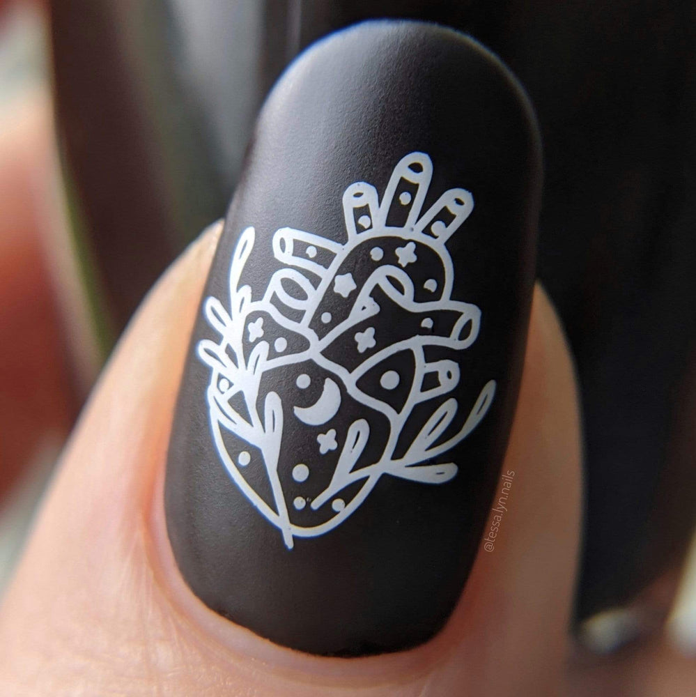 A manicured hand in black with Bewitched: Potions 101 design by Maniology (m151).