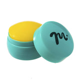 A Big Gummy XL Round Opaque Yellow/Teal Nail Stamper with a 1.5 inch diameter stamping head by Maniology.