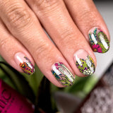 Manicured hand in botanical designs by Maniology.