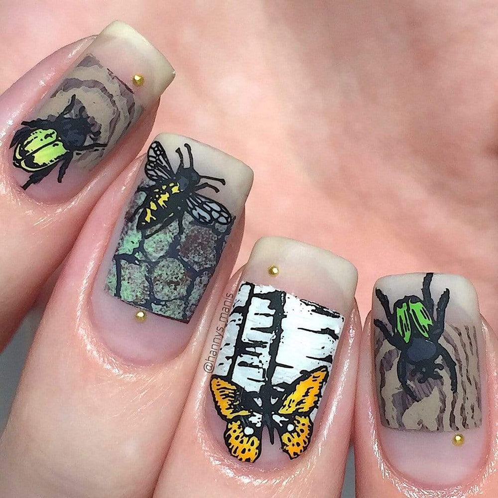 A manicured hand with a flight of insects design.