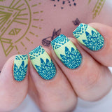 A tribal summer look manicured hand using Maniology's Daydreamer nail stamping plate.