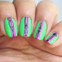 A manicured hand in green with geometric designs by Maniology (m053).
