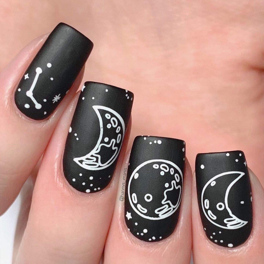 A manicured hand with moon phases design by Maniology (m119).