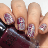A manicured hand in glitters with cats design holding a polish.