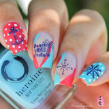 A manicured hand with beach vibes design by Maniology Sun & Sand (m104).