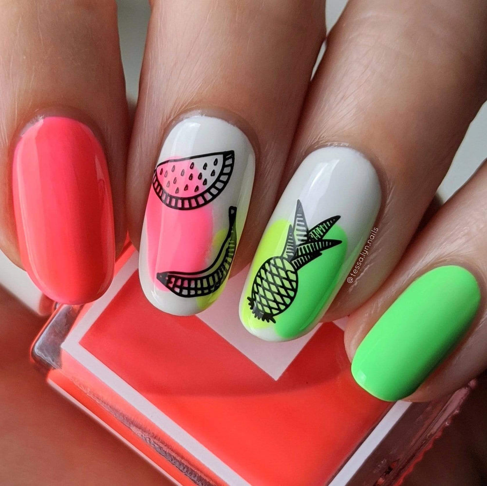 A manicured hand with pineapple, watermelon and banana designs by Maniology Sun & Sand (m104) holding a polish.