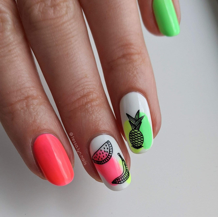 A manicured hand with pineapple, watermelon and banana designs by Maniology Sun & Sand (m104).