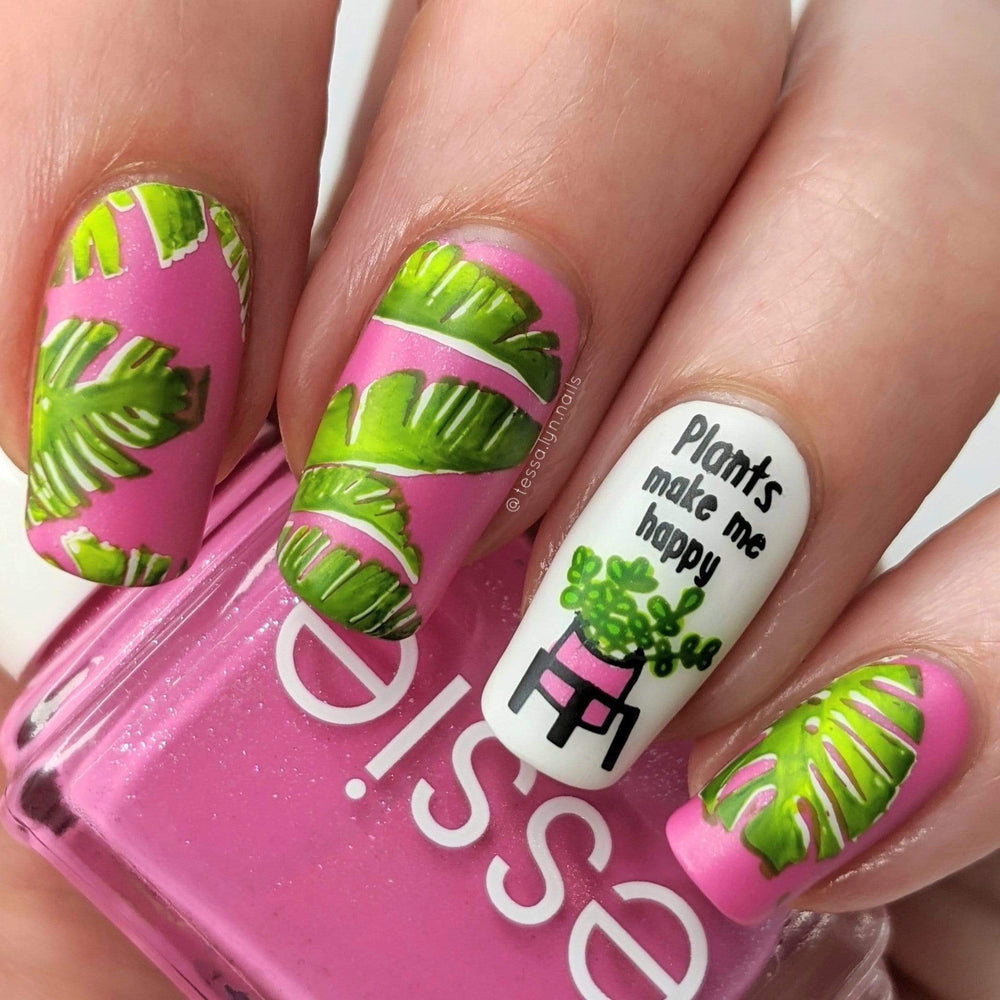 A manicured hand with plants and leaves design by Manilogy (m095) holding a polish.