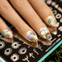 A manicured hand pretty flower petals design over a stamping plate by Maniology (m026).
