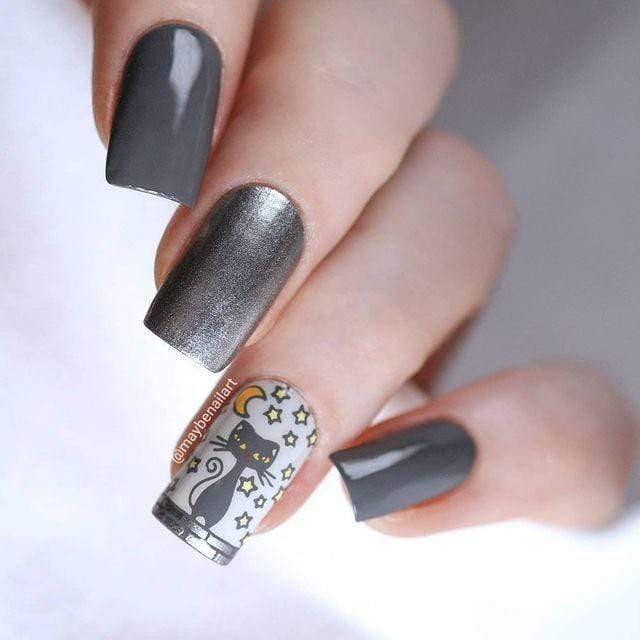 A manicured hand made with Dark Gray Nail Art Stamping Polish - Storm Cloud by Maniology.