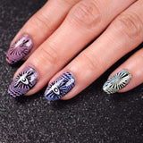 A manicured hand with abstract designs